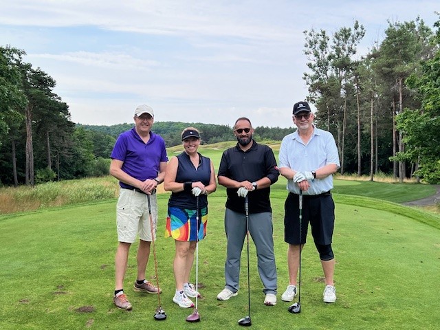 group photo of swa members at golf tournament.